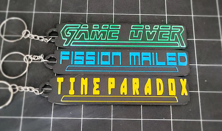 Metal Gear Solid Key Chains Game Over Fisson Mailed Time Paradox SNAAAKE